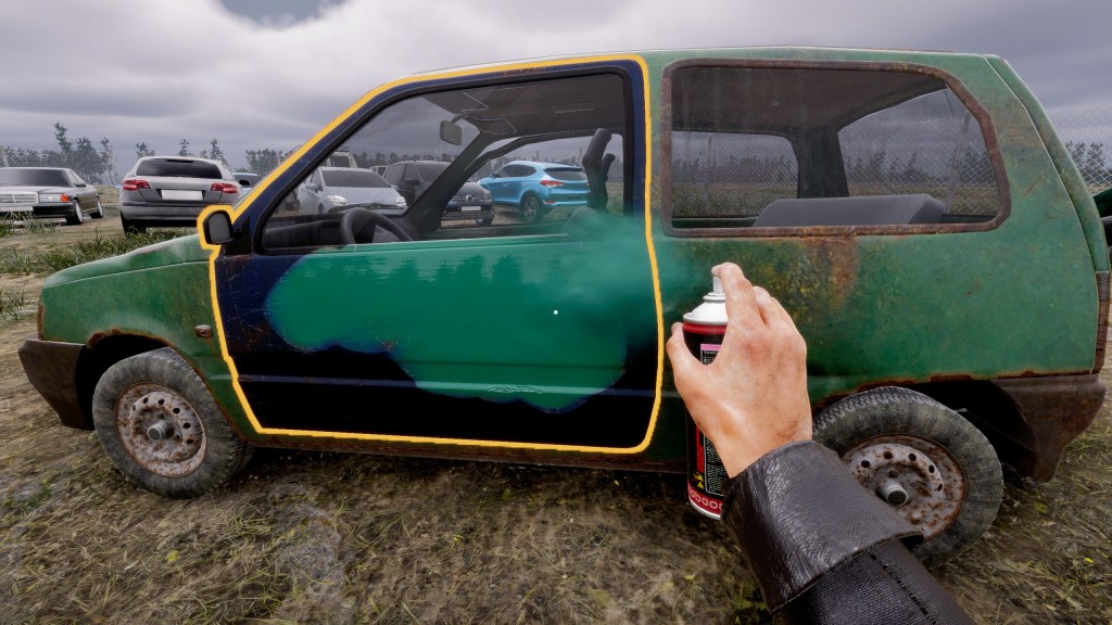 Player spray painting a rusty car in Totally Legit Wheeler Dealer game