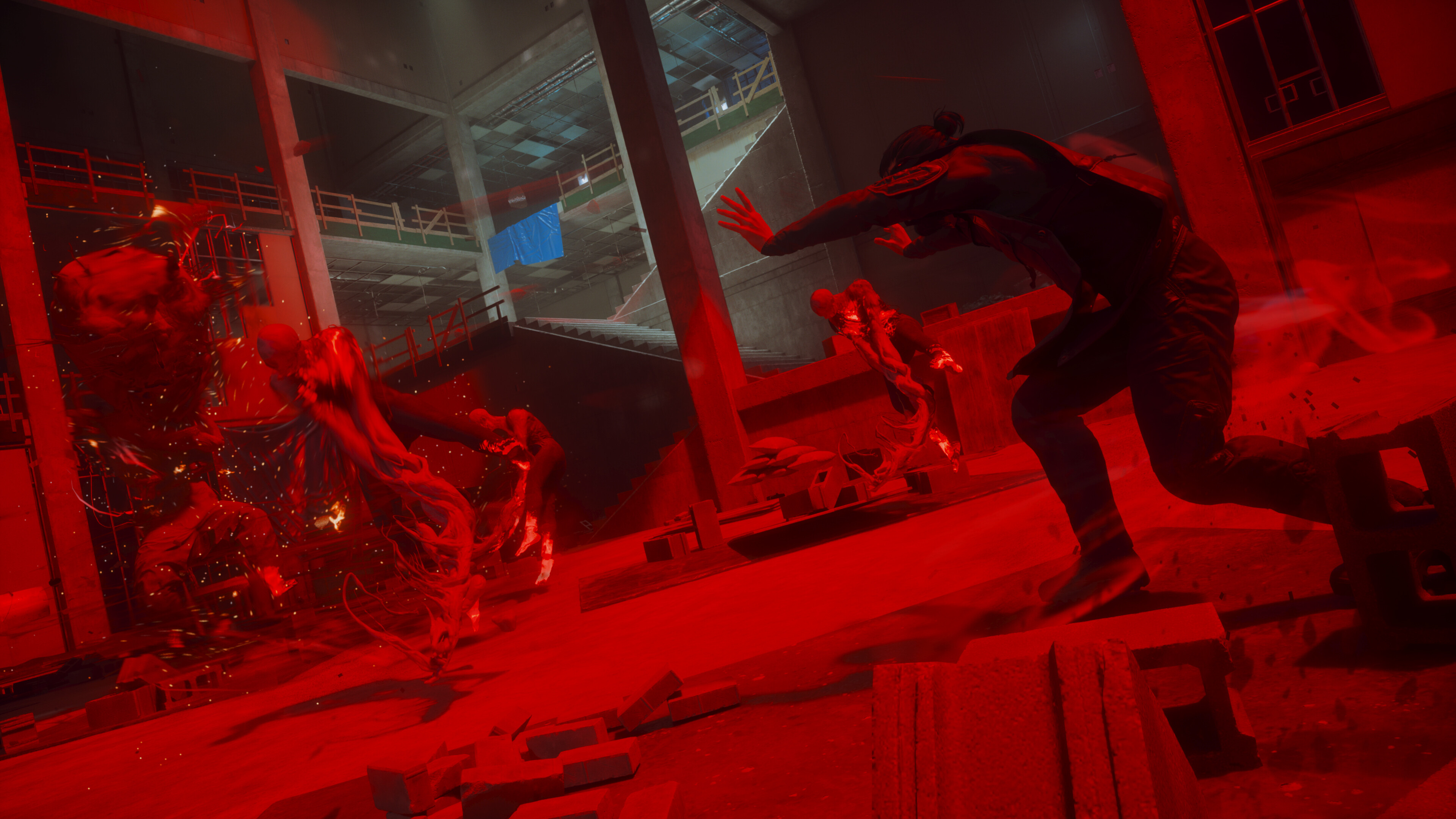 Dylan Faden battles supernatural forces in a red-tinted action scene from Control: Resonant.