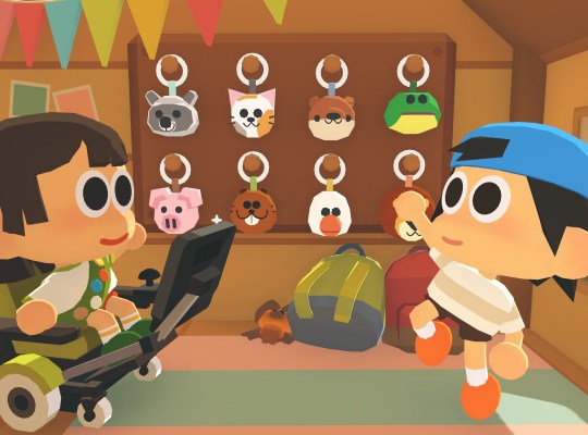 Two kids at summer camp exploring keychains in Find Your Words game.