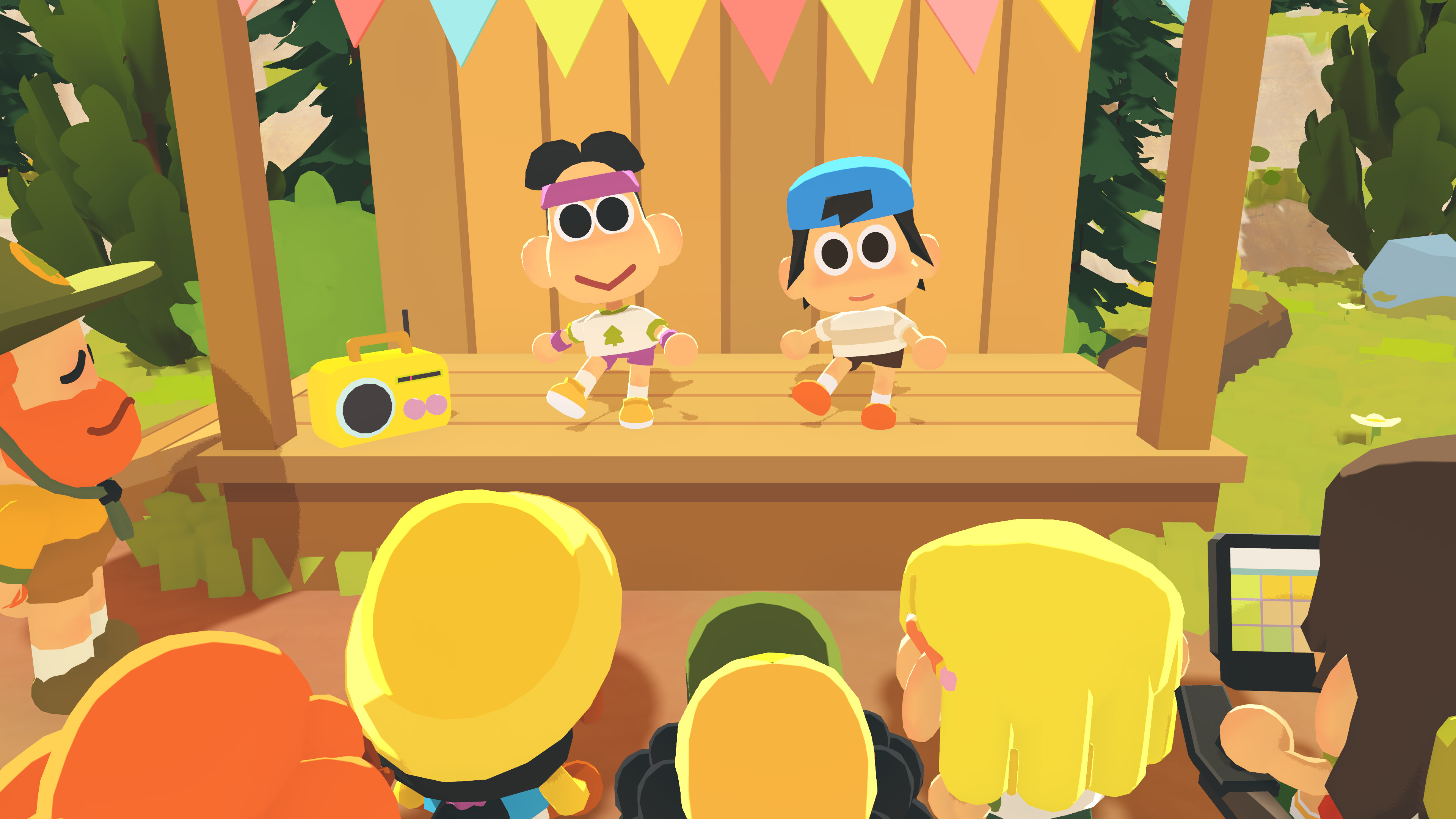 Two animated characters on stage at summer camp with audience watching in Find Your Words game.