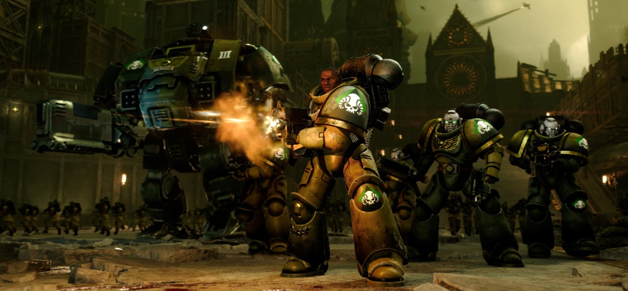 Epic battle scene from Total War: WARHAMMER 40,000 showcasing Space Marines and a massive walker.