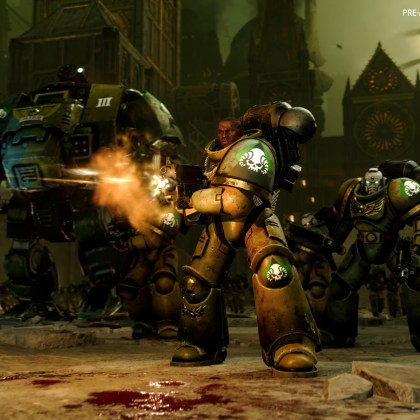 Epic battle scene from Total War: WARHAMMER 40,000 showcasing Space Marines and a massive walker.