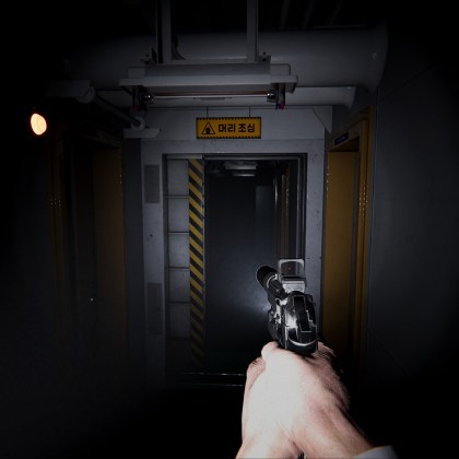 First-person view of a character holding a gun in a dark corridor aboard a ship.