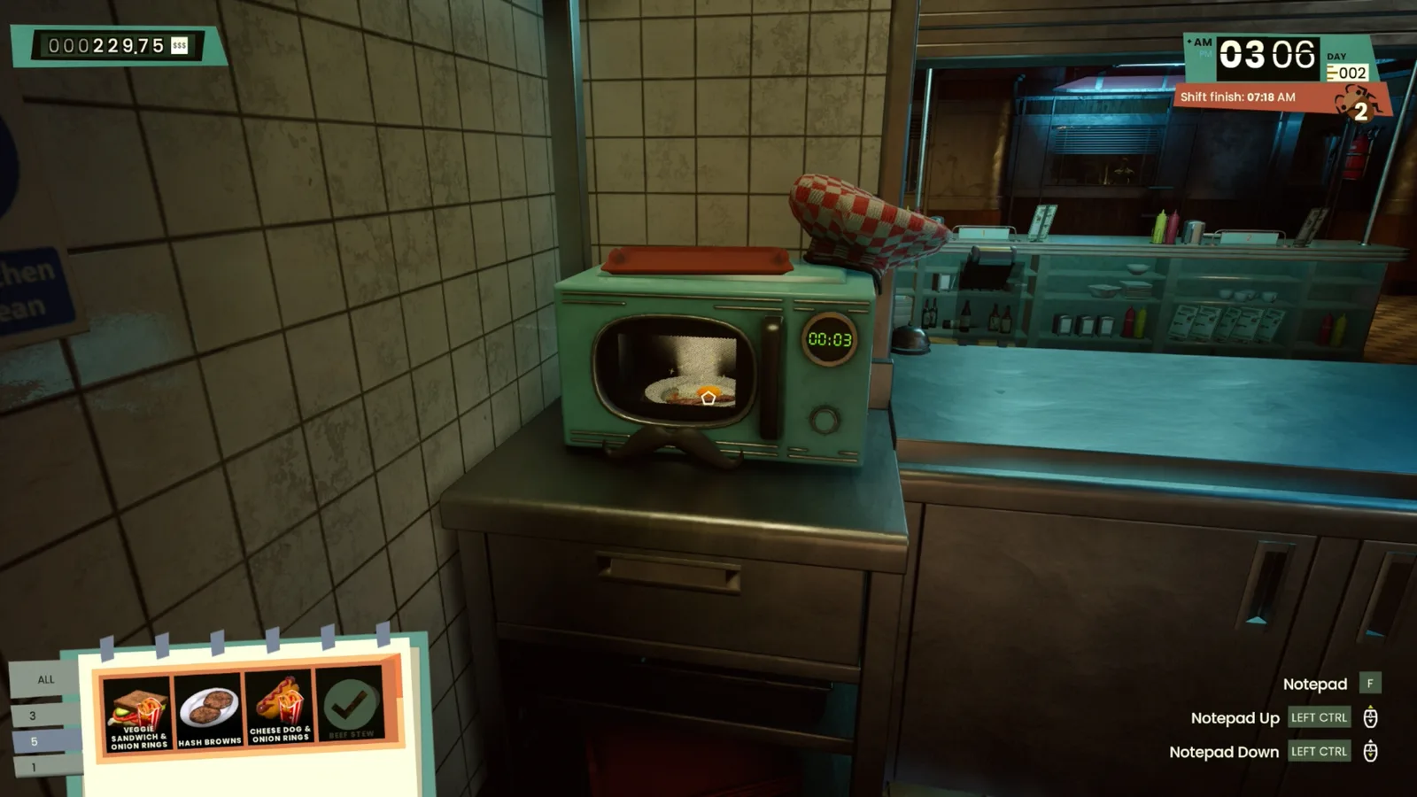 In-game kitchen scene featuring a retro microwave and notepad in Road Diner Simulator.