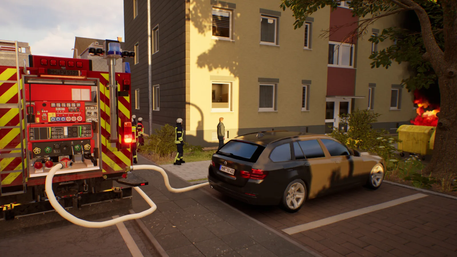 Firefighting simulation scene with a fire truck and a burning dumpster